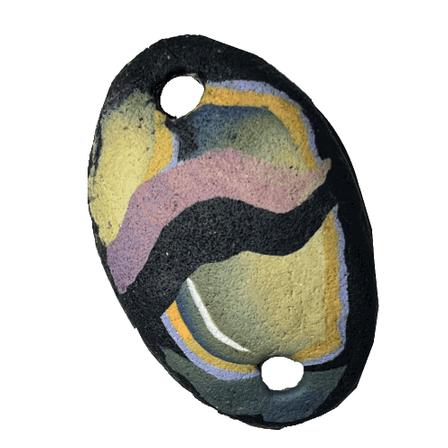 A gif of a handmade polymer clay pendant, oval-shaped with a hole on either end, spinning in circles. The pendant is black with abstract strokes of blue, purple, and yellow.