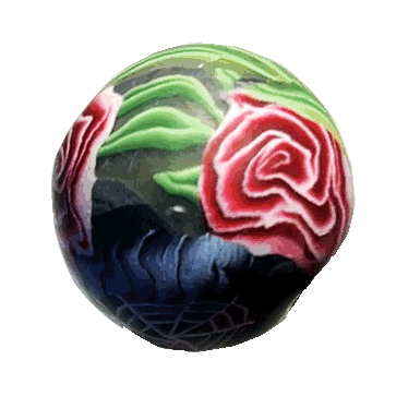 A gif of a handmade polymer clay bead with a rose, spiderweb, and green leaves spinning around an invisible axis.
